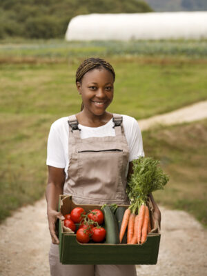 front-view-smiley-woman-with-harvest